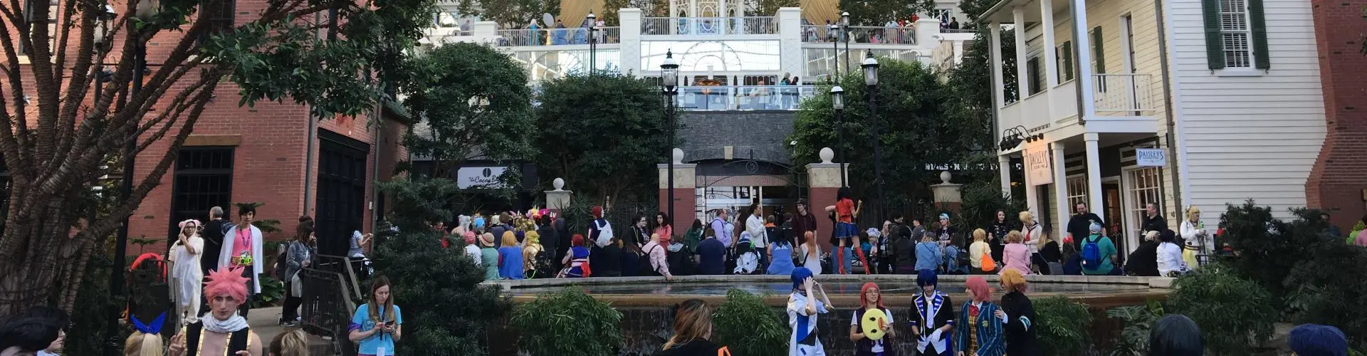 People cosplaying outside during a convention.