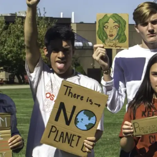 Arcadia students hold cardboard signs at the global climate strike