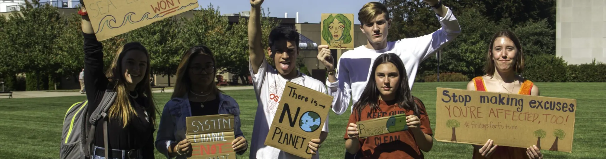 Arcadia students hold cardboard signs at the global climate strike