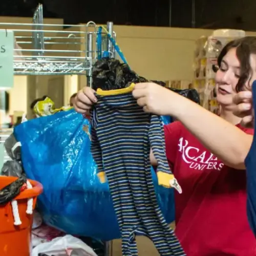 Students at Day of Service organizing clothes