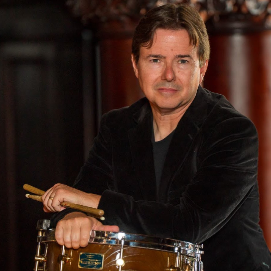 Sean Kennedy headshot with drum