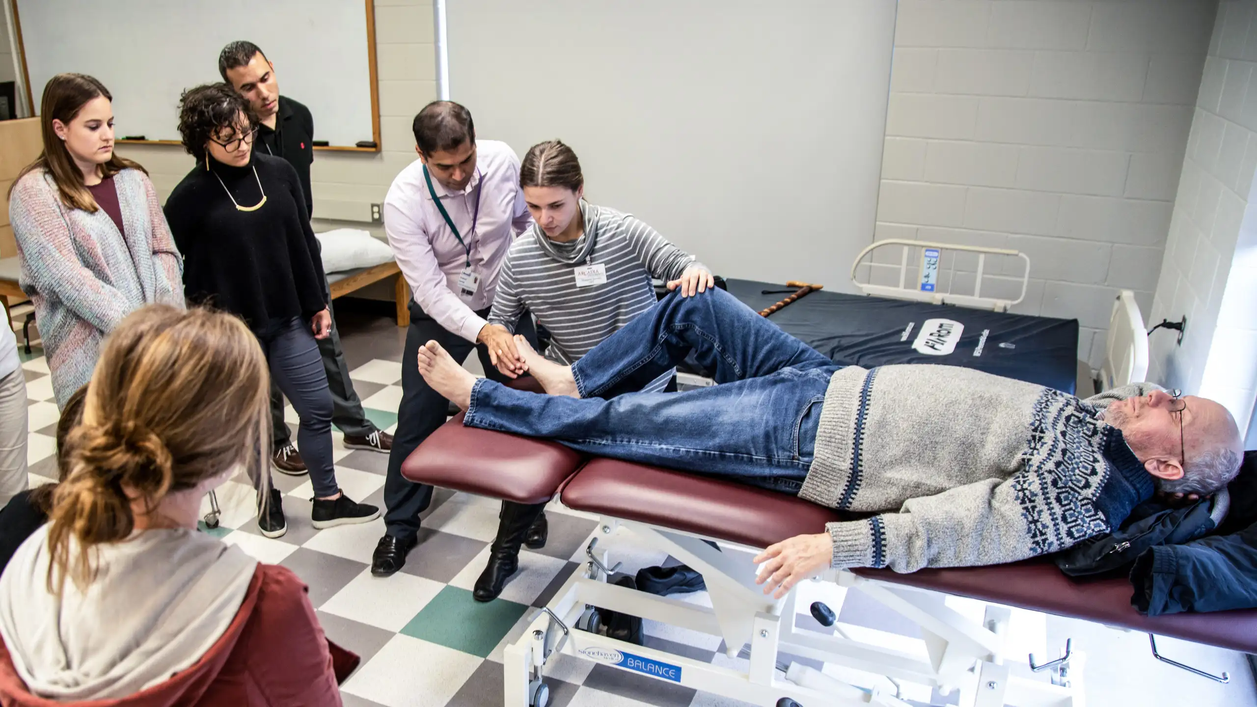 Students watch a PT demonstration.