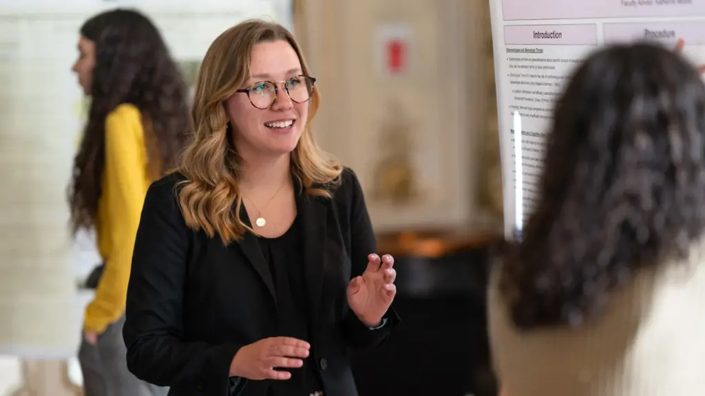 A psychology student presents her capstone project.