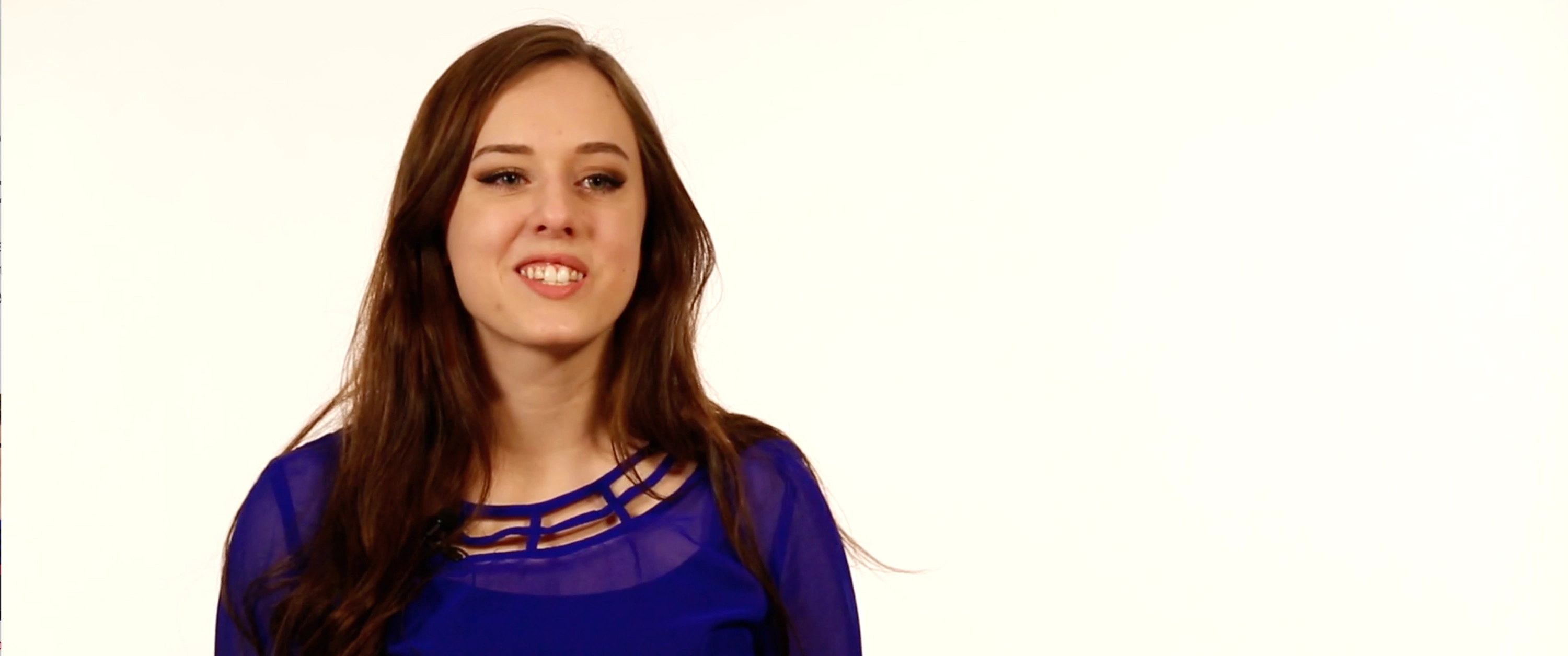 Portrait of a woman wearing purple shirt