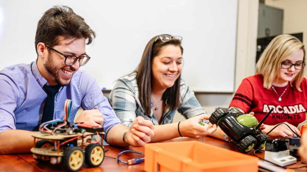 Students work with remote control vehicles.