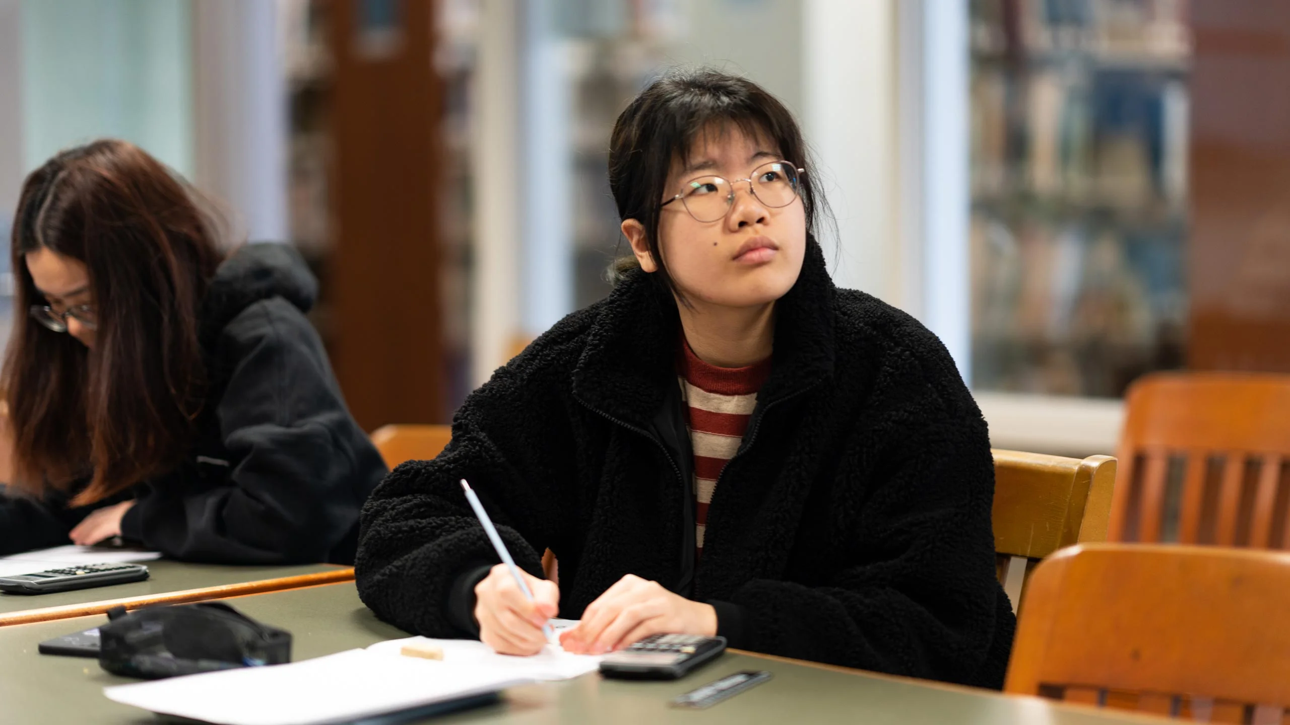 A student works in math class.