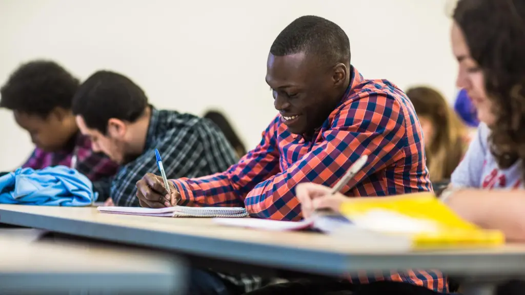 A student takes notes in a Spanish class at Arcadia University.