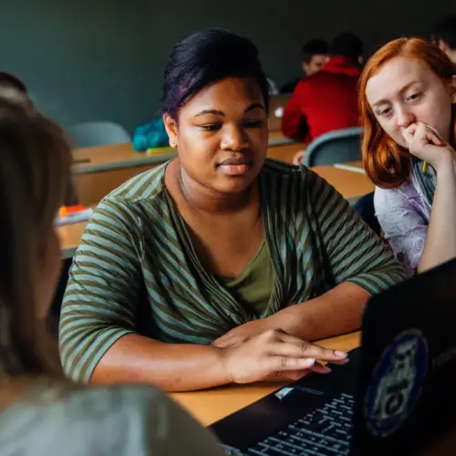 Arcadia students study in a classroom on campus