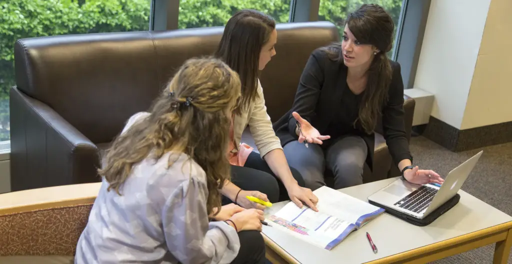 Public Health students talk outside of class