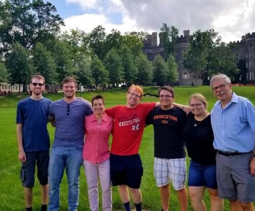 A family standing together on Haber Green