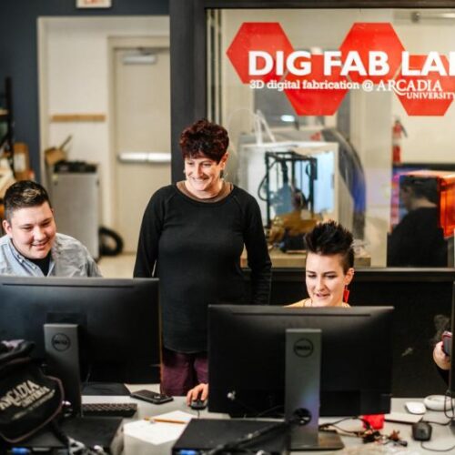 Professor Karen Misher works with students in the Digital Fabrication Lab.