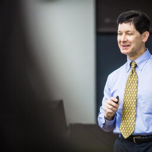 Candid portrait of Dr. Brinker in a classroom