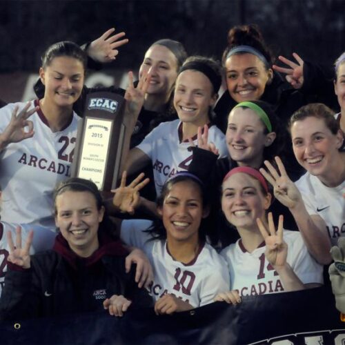 The women's soccer team holds the ECAC trophy