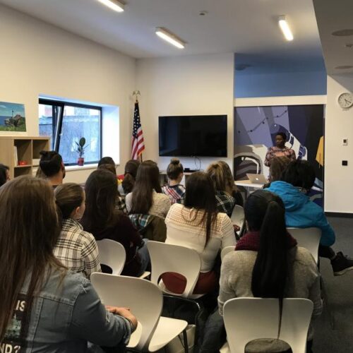 Dr. Eaton speaks to a classroom full of students.