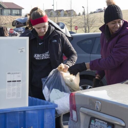 Students loading a cart as part of the MLK Day of Service project