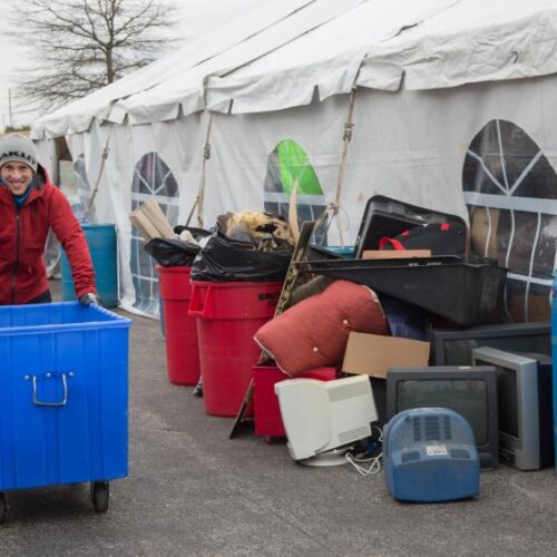 A student pushing a cart as part of the MLK Day of Service