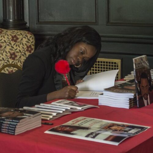An author signing her poetry books.