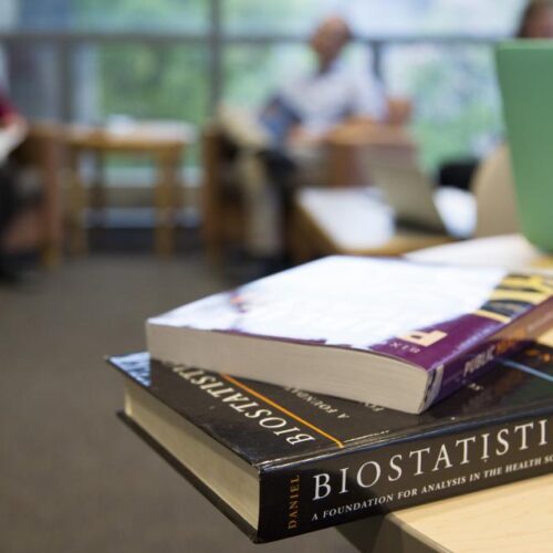 Two books sitting on a desk.