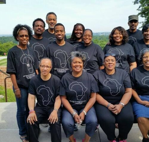 Attendees posing for a picture at the Black Male Development Symposium