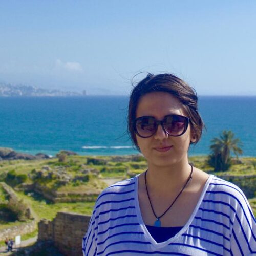 A student smiling while on an island