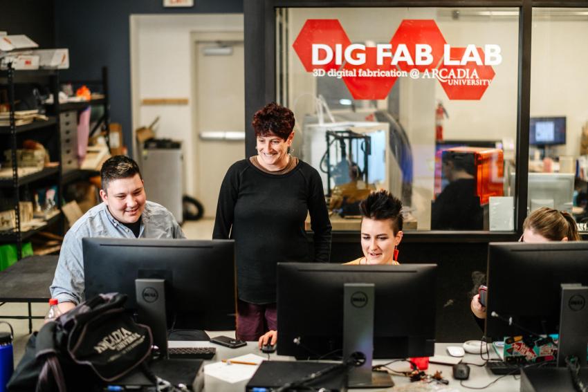 Professor Karen Misher works with students in the Digital Fabrication Lab.