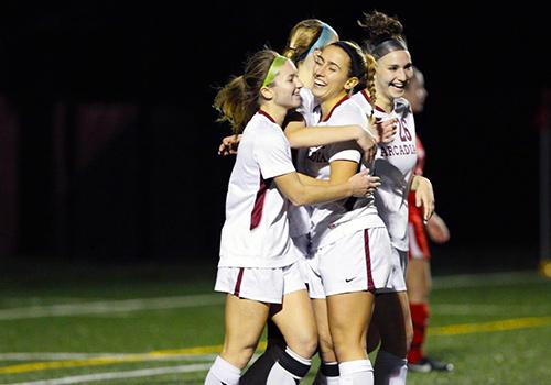 Happy female athletes after a huge win