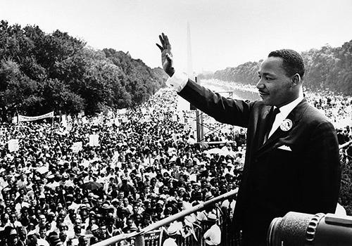 Martin Luther King Jr. waves to the crowd at the March on Washington