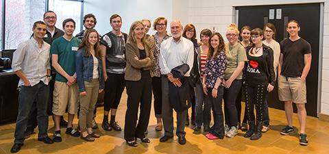 Artist's Tony and Eliza Auth standing with several students