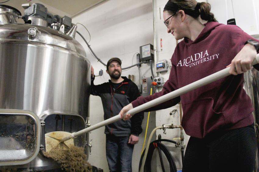 A student working at a brewery