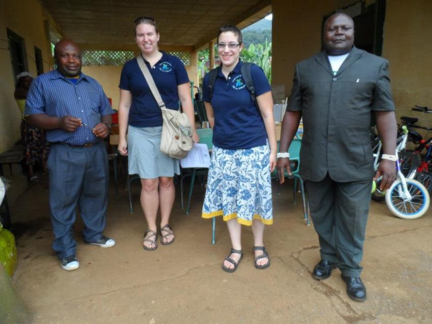 Four people standing together.