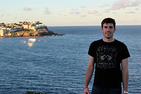 A student with Australia in the background.