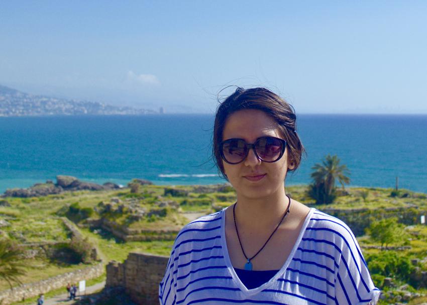 A student smiling while on an island