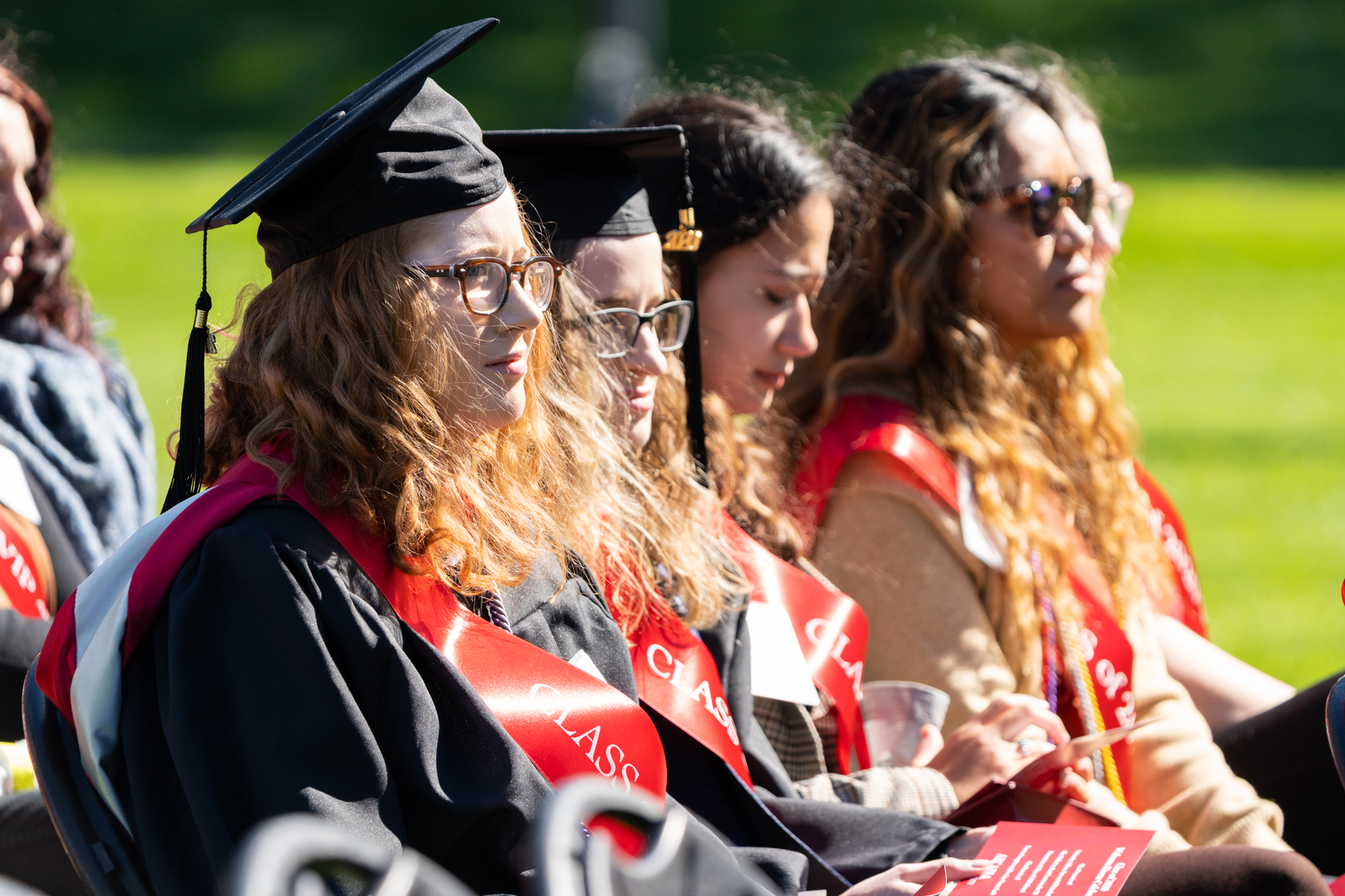 Alumni from the class of 2020, wearing their cap and gown, are celebrated in a ceremony during the 2022 Homecoming & Family Weekend