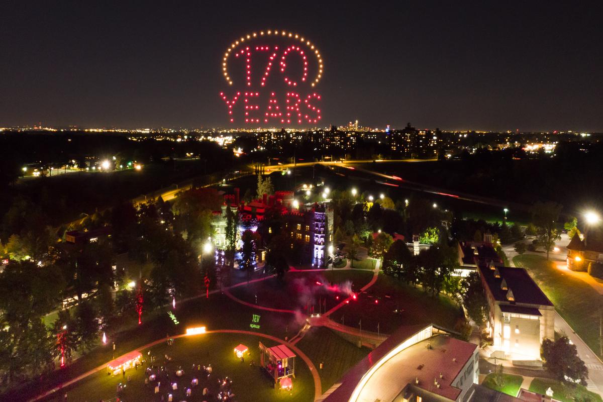 Drones lit up in yellow and red spell out 170 years over Grey Towers Castle