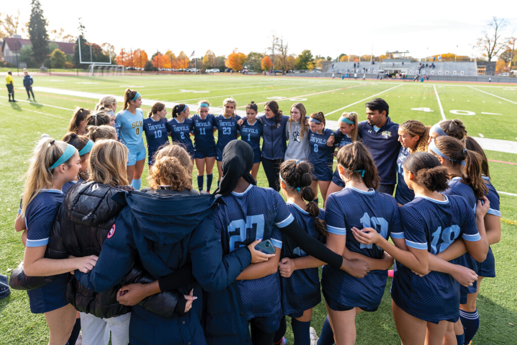 Maria DeGeorge-Kosmin '06 and the girls' soccer team she coaches