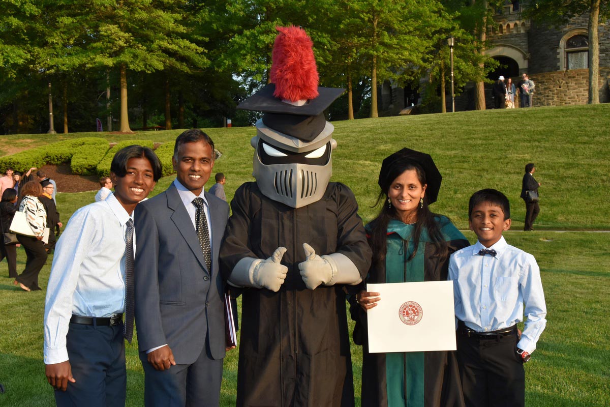 A graduate and her family with Archie the Knight