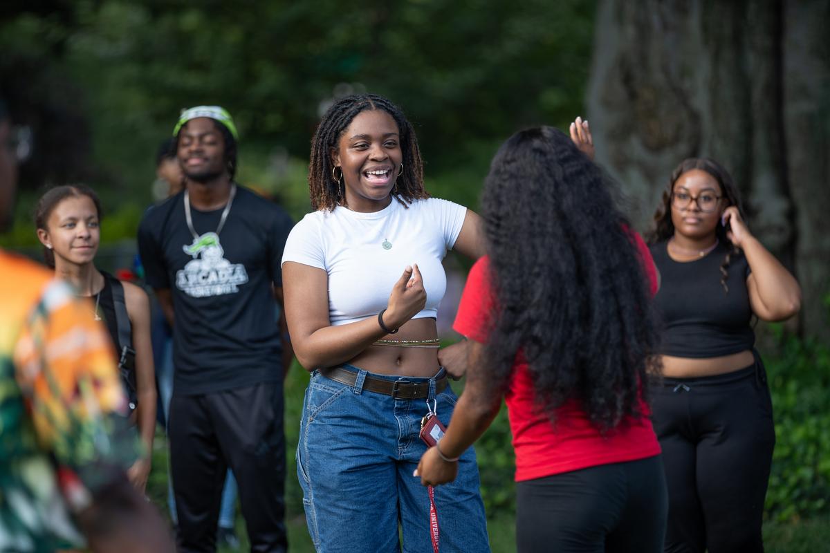 Students having a great time with each other at the Welcome Black Picnic.