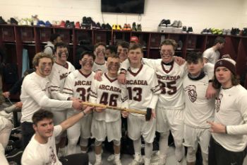 Arcadia Lacrosse Team assembled in the locker room