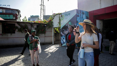 Arcadia students enjoy each others company as they travel abroad in a sunny urban area.