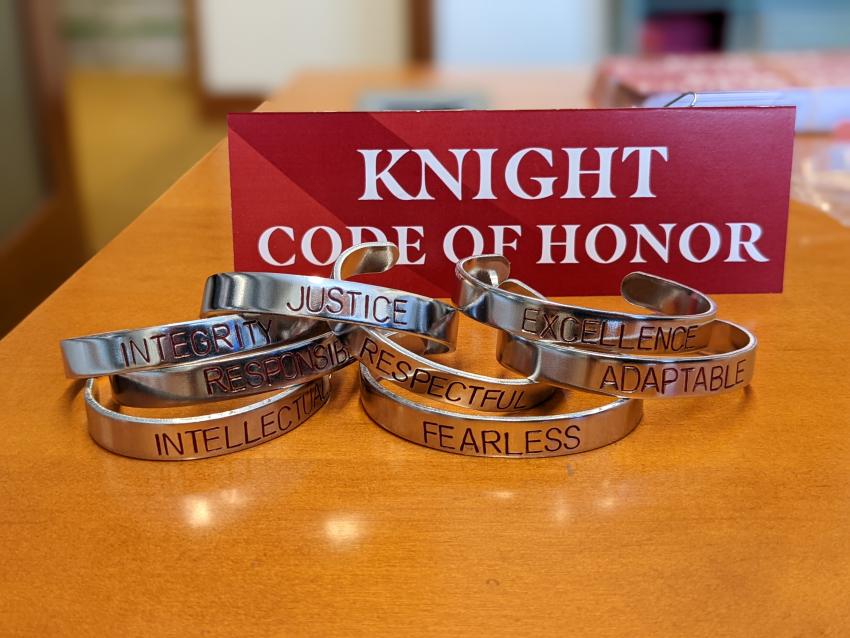 Knight Code of Honor metal bracelets on display