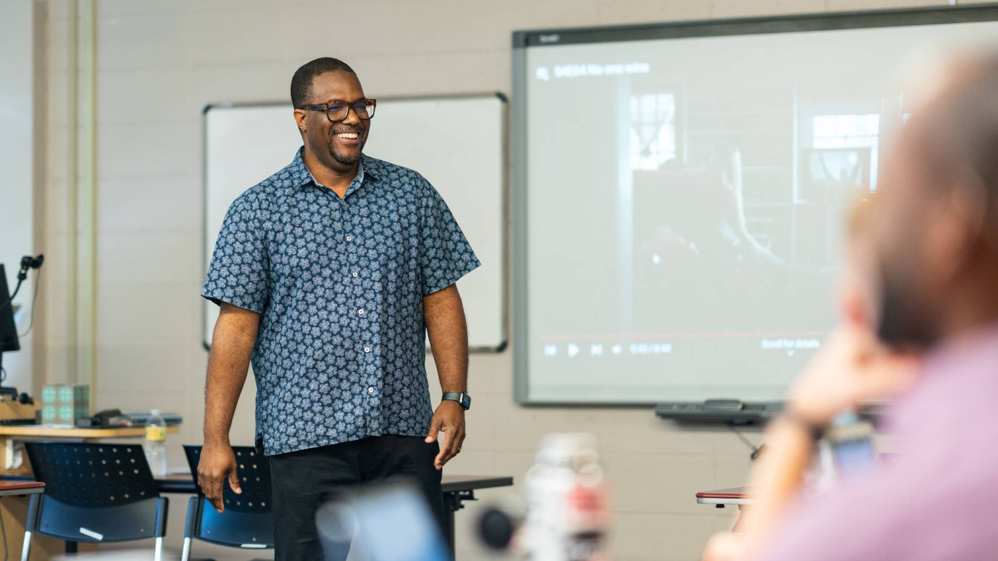 Dr. Bruce Campbell smiles during a class.