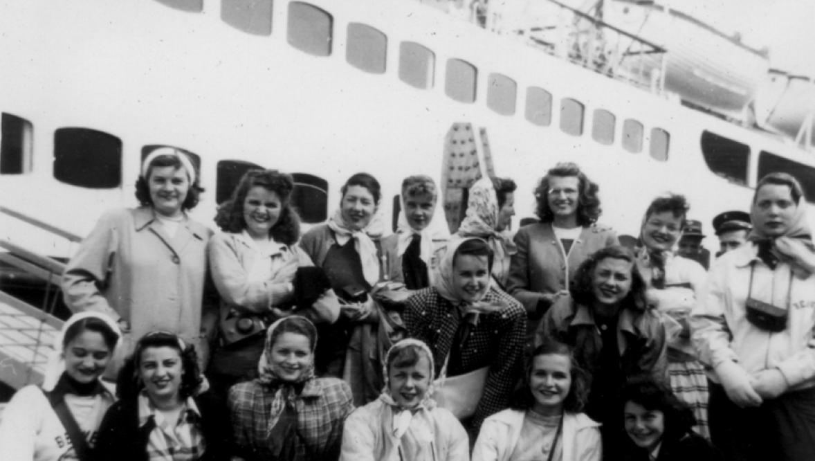 Arcadia students pose in front of an ocean ship in Belgium.