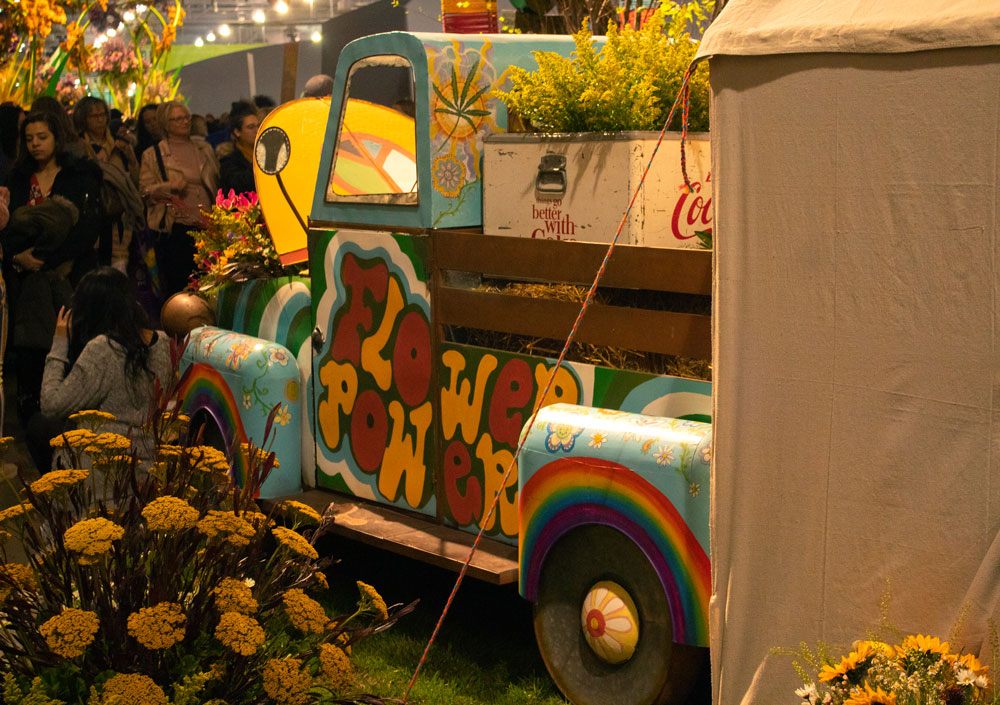 A colorful antique flower truck.
