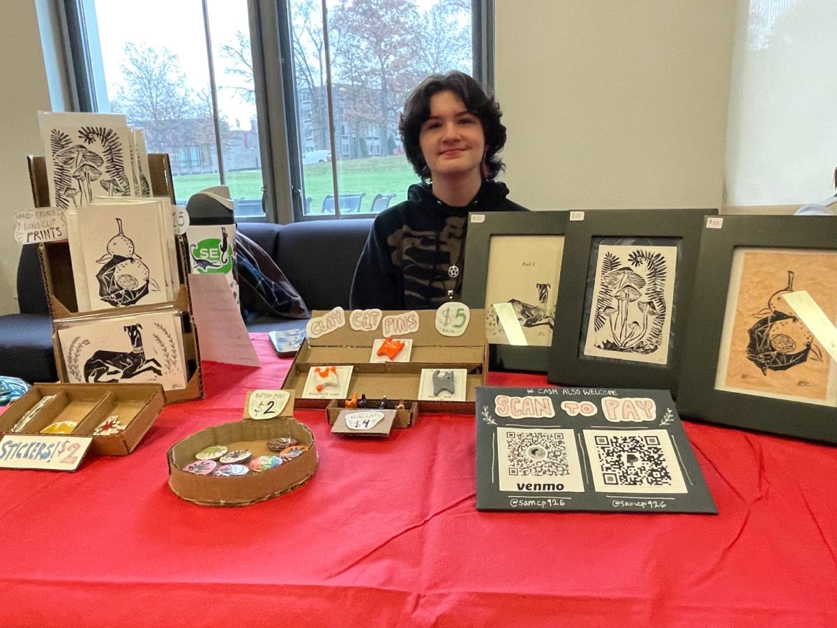 A student vendor at the First Friday Holiday Art Sale.