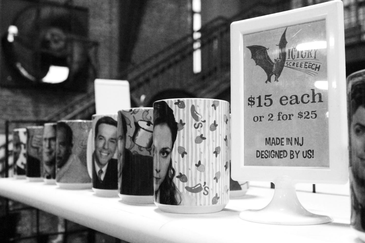 Different coffee mugs with the portrait of characters from the Office.