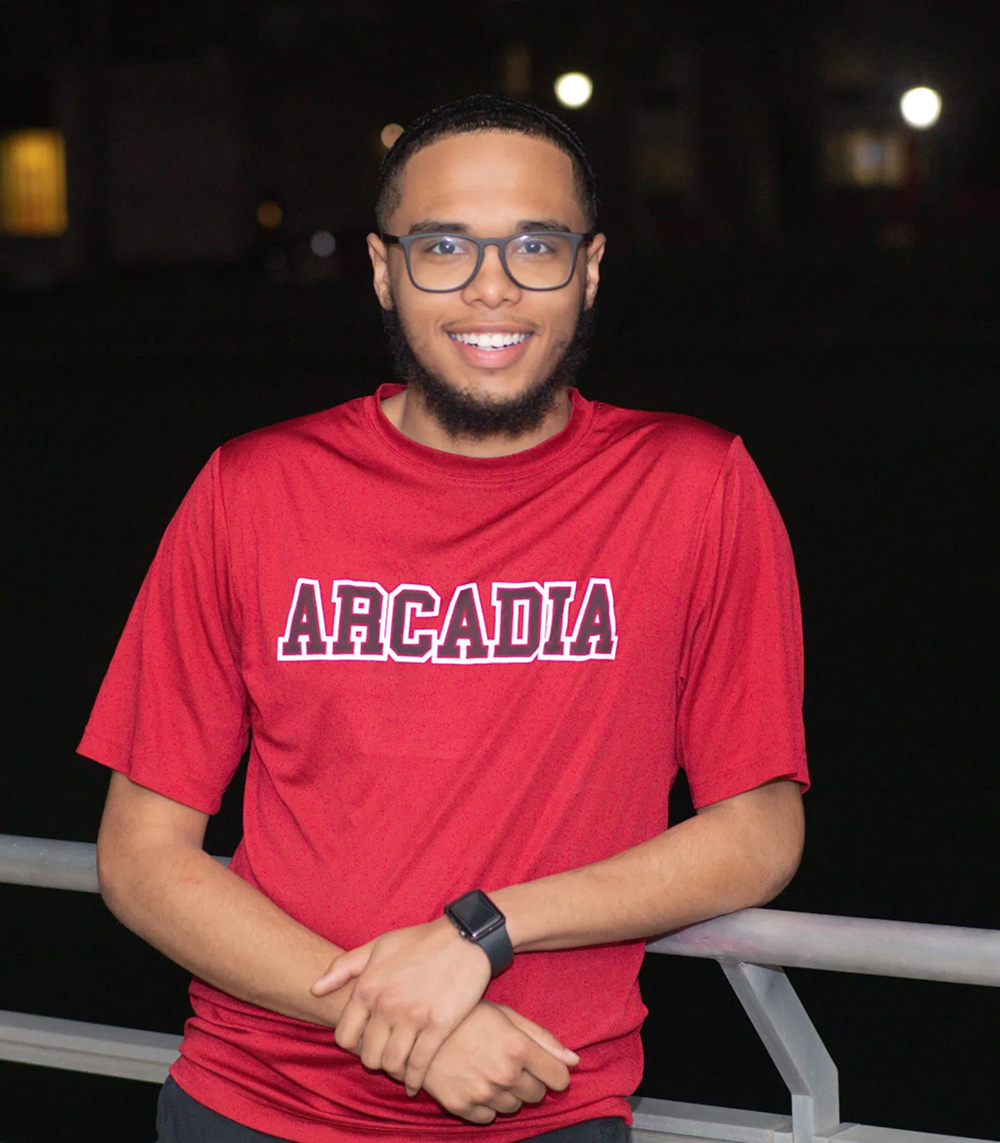 Noel Gonzalez Jr., History Major with a Secondary Education Minor, Class of 2025 smiles and wears a red shirt.
