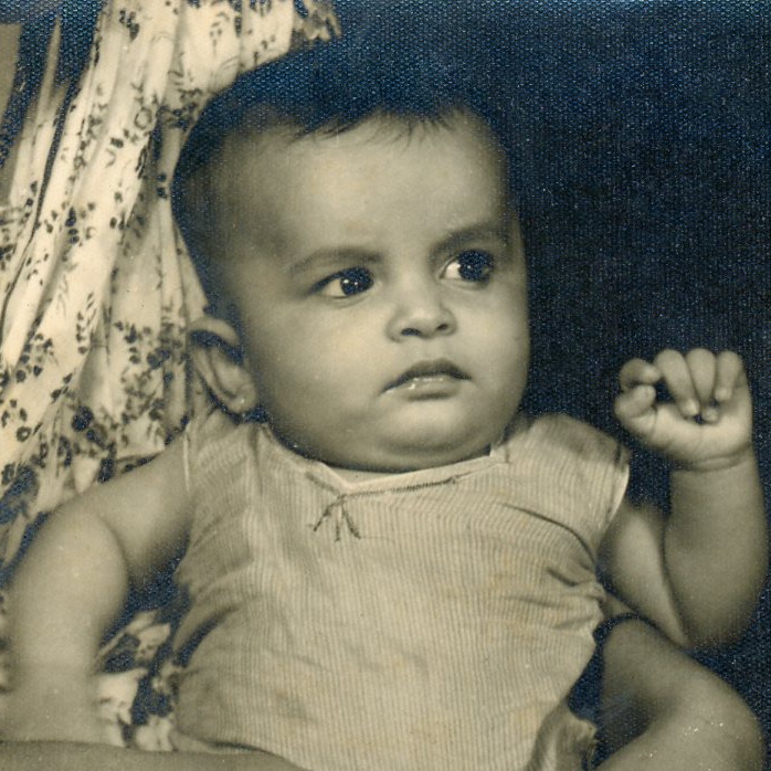 A black and white photo of a baby
