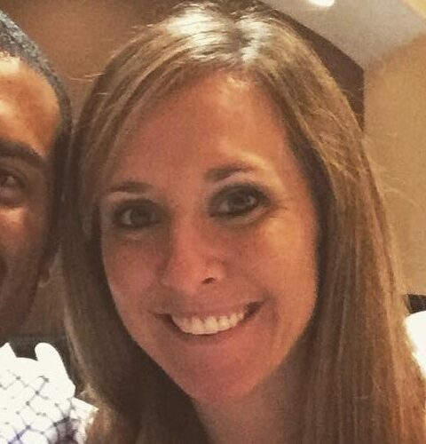 A photo of a woman with a man cropped out