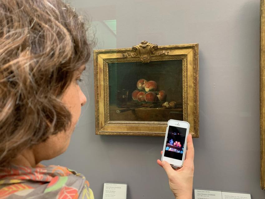 Artist comparing paintings in Paris