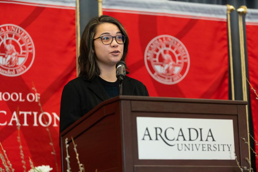 Student speaker Mia Woo '22 at Arcadia University podium